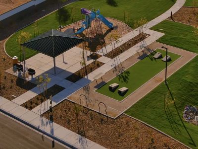 Park with playground, cornhole and BBQ Grills at Camino Crossing.
