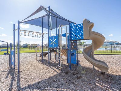 Kiddos will enjoy the community playground with shaded play equipment.