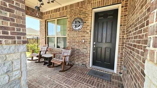 Property entrance featuring covered porch