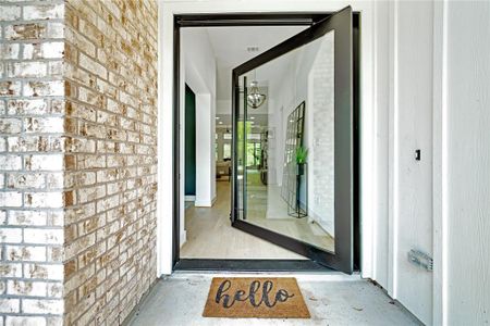 Solid glass and iron entry way door