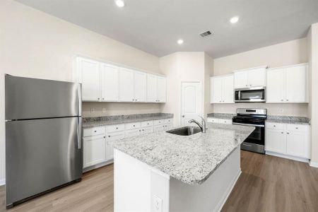 The kitchen in the this floor plan is a perfect place to gather as a family or host guests.