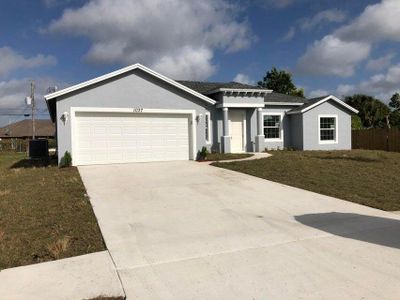 New construction Single-Family house 631 Southeast Prineville Street, Port Saint Lucie, FL 34983 - photo 0