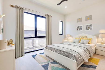 Bedroom with ceiling fan and light hardwood / wood-style floors