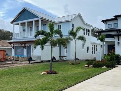 New construction Single-Family house 606 Yupon Ave, New Smyrna Beach, FL 32169 - photo 0