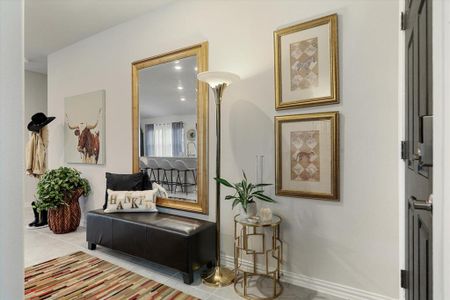 Entrance hall featuring light tile patterned floors.