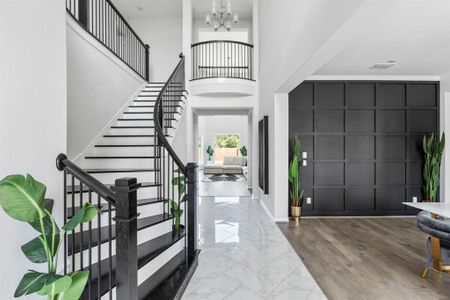 Embrace luxury as youenter this home, where an expansiveand inviting entryway sets the tonefor a grand living experience.