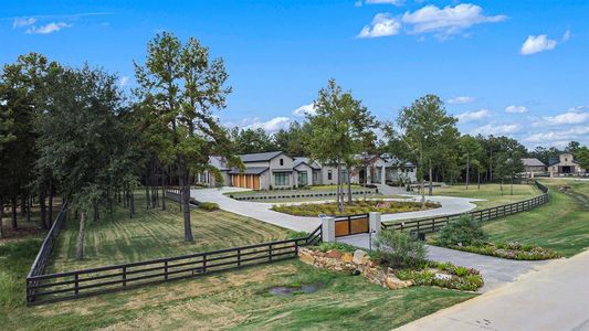 Full view of the front gated entrance into this astonishing home!