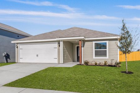 Ranch-style house with a front yard and a garage