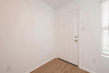 The light and bright entryway, complete with a large window by the front door, welcomes you and your guests into this beautiful home.