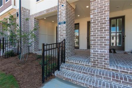 Front Entry with a Fenced Private Yard , Covered Terrace , with Front Door and Sliding Glass Door. not the actual unit previously built