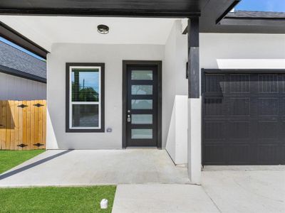 Doorway to property with a garage