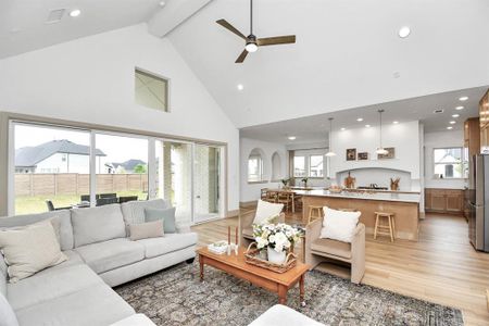 Expansive open concept floorplan with natural light throughout; the living, kitchen and dining flow seamlessly.