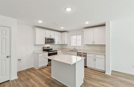 Bright kitchen with ample cabinet space *real home pictured