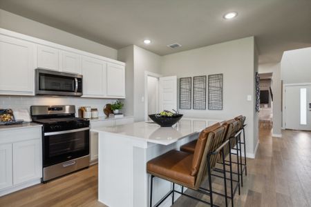 Kitchen in the Willow home plan by Trophy Signature Homes – REPRESENTATIVE PHOTO