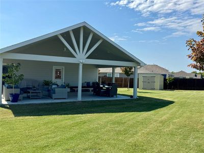 The shed in the back is perfect for storing the riding lawn mower and yard tools!