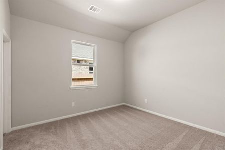 Your secondary bedroom features plush carpet, fresh paint, closet, and a large window that lets in plenty of natural lighting.