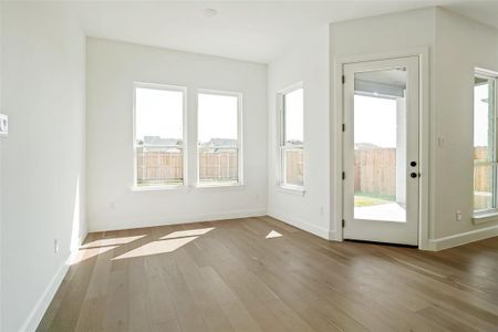 Entryway with light hardwood / wood-style floors