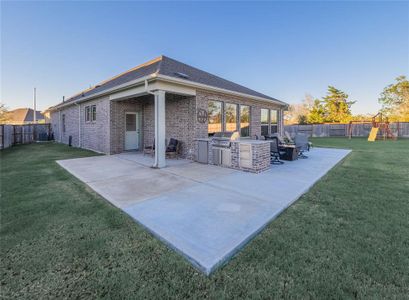 extended back patio with fabulous outdoor kitchen