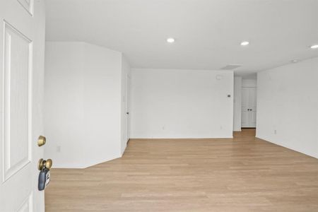 Walking in, you find a bright entryway with beautiful light wood like flooring that continues throughout the first floor in the main living areas making it easy to clean and maintain.