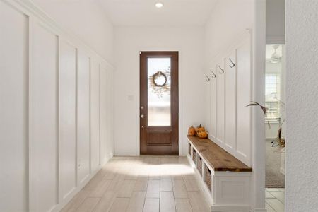 Mudroom with a wealth of natural light and ceiling fan