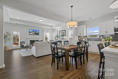 PHOTO REPRESENTATION ONLY. Casual dining area of decorated model home.