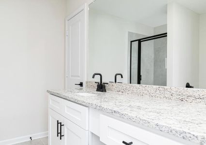 The gorgeous master bathroom is the perfect place to get ready for your day