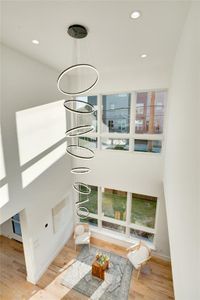 Room details with hardwood / wood-style flooring and a chandelier