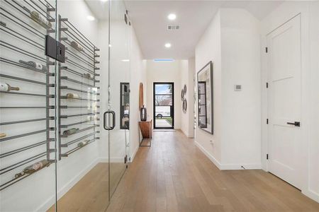 Hall featuring light wood-type flooring