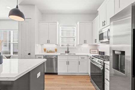 A window above the kitchen sink fills the room in natural light, making this kitchen both a beautiful and practical space for your culinary endeavors! *All interior photos are from the model home: 5216 Pine Tree*