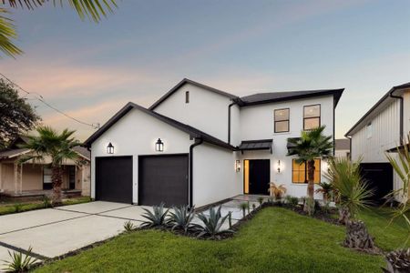 Contemporary house with a garage and a yard