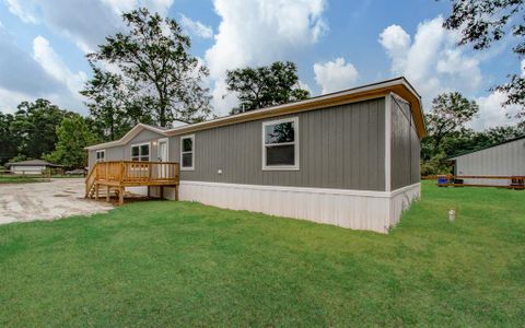 New construction Single-Family house 148 County Road 328, Cleveland, TX 77327 - photo 2 2