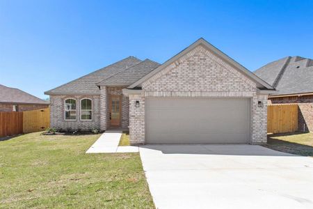 View of front of property featuring a garage and a front lawn