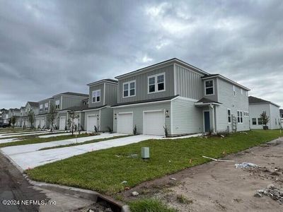 New construction Townhouse house 14467 Macadamia Lane, Unit 323, Jacksonville, FL 32218 - photo 0