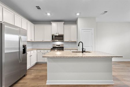 Kitchen with upgraded Whirlpool kitchen appliances.