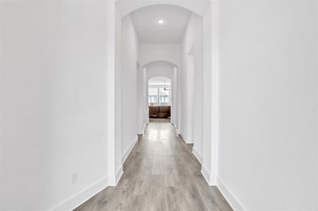 Corridor with light wood-type flooring