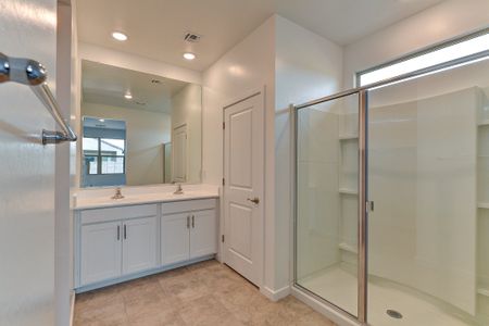 The Olive floorplans primary bathroom with dual sinks.