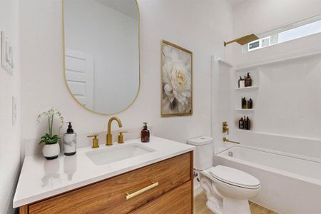 Full bathroom featuring bathing tub / shower combination, vanity, hardwood / wood-style flooring, and toilet