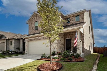 Craftsman inspired home with central AC unit, a garage, and a front lawn