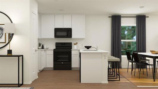 Kitchen featuring hardwood / wood-style floors, black appliances, white cabinetry, and a kitchen breakfast bar