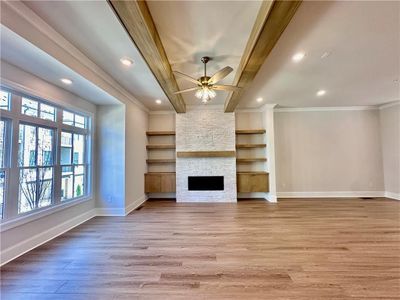 The warmth of your living room showcase through your hardwoods throughout 10 foot ceilings