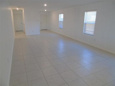 Unfurnished room featuring a wealth of natural light and light tile patterned floors