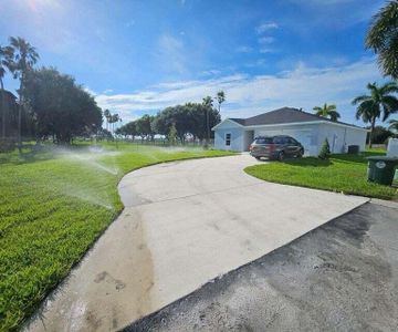 New construction Single-Family house 156 Dabou Loop, Belle Glade, FL 33430 - photo 0