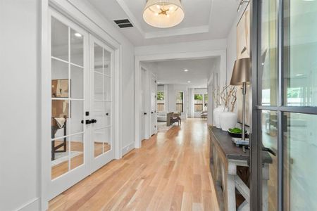 ests are greeted by a wide entryway w/ white oak wood floors, designer selected light fixture, 1st Floor Study and plenty of natural light.