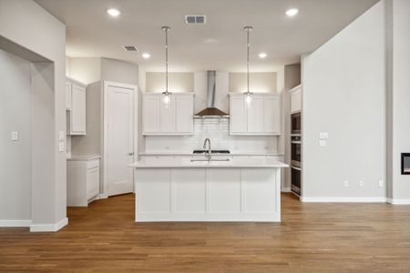 Kitchen in the Da Vinci II home plan by Trophy Signature Homes – REPRESENTATIVE PHOTO