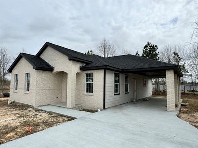 New construction Single-Family house 405 County Road 3566, Cleveland, TX 77327 - photo 1 1