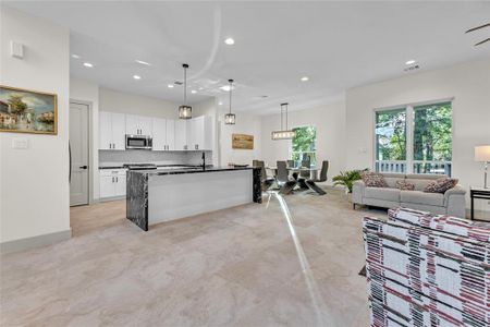 Large open concept from kitchen, breakfast area to living area