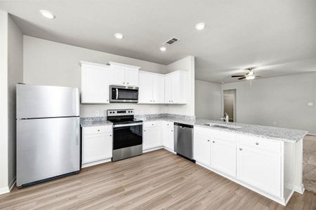 Kitchen with upgraded Whirlpool kitchen appliances.