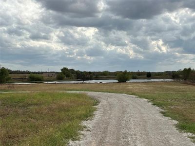 View of street featuring a water view and a rural view