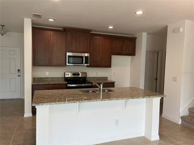 New construction Townhouse house 4812 Noble Cypress Street, Kissimmee, FL 34746 - photo 1 1