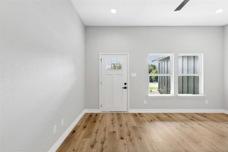 Mudroom with light wood-type flooring